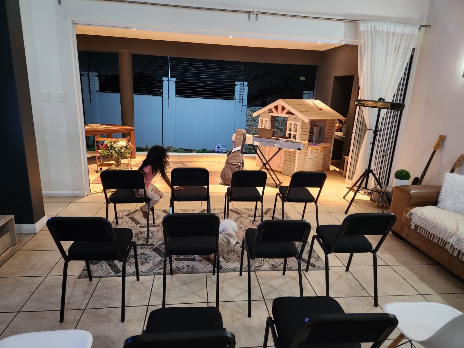 Chairs set out in the living room for our first service