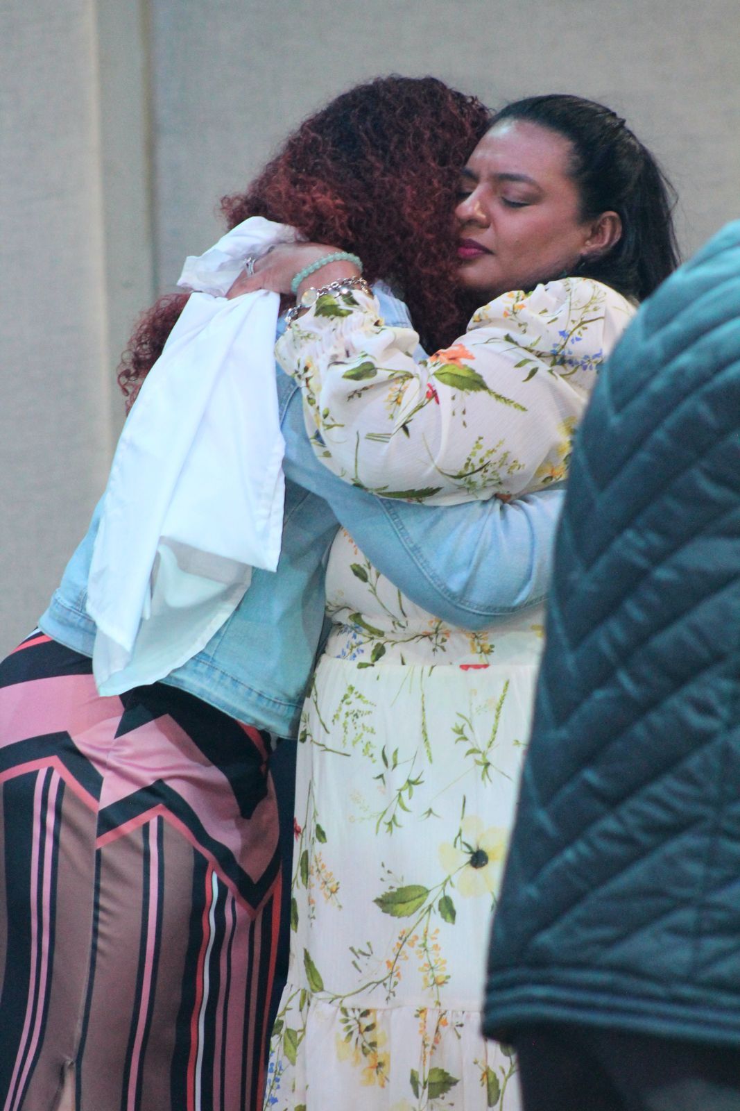 Two women embracing at Calvary Church