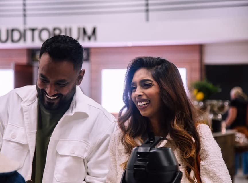 Pastor Ashlin and Candace laughing together at a Calvary Church event