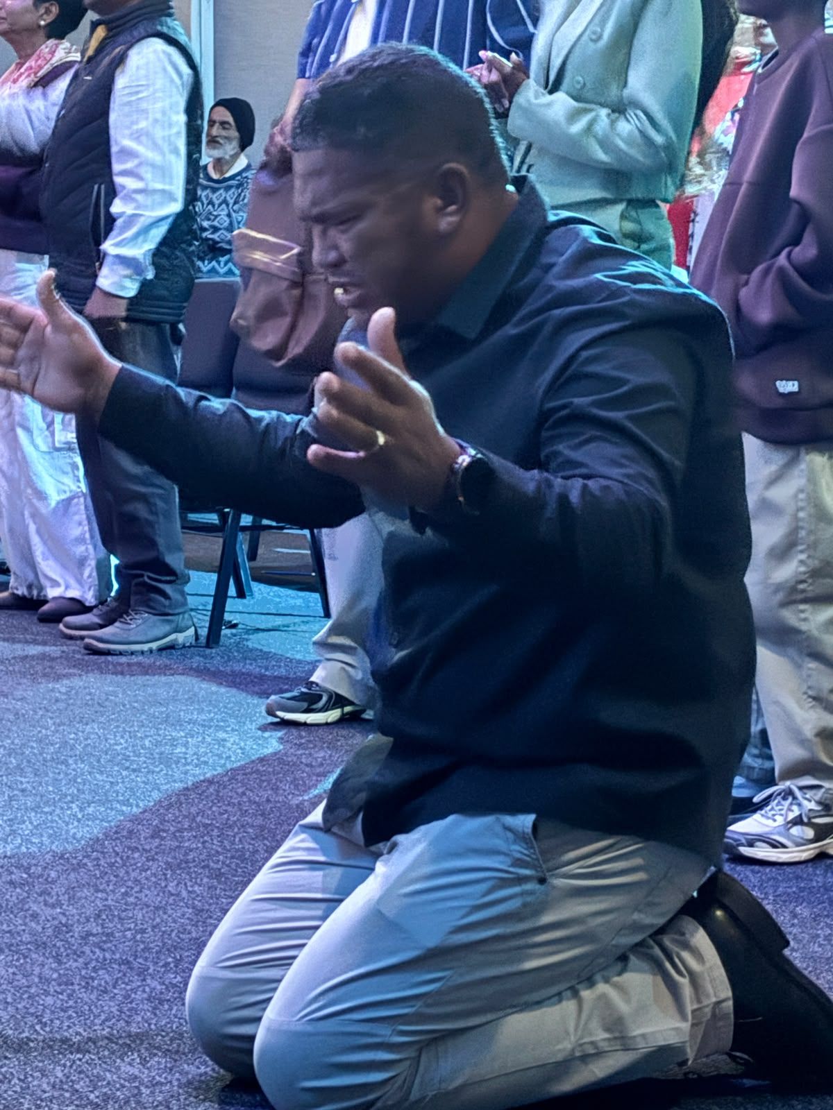 A man kneeling in prayer